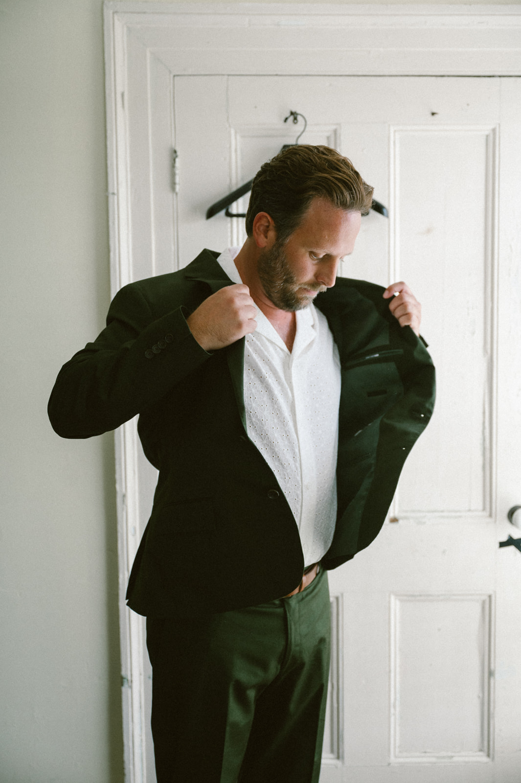 forest green groom's suit