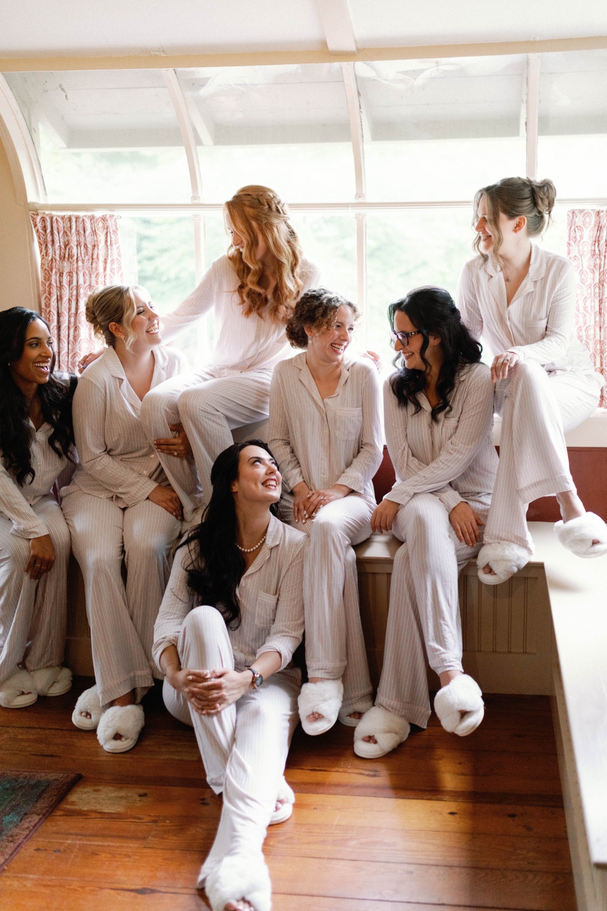 bridesmaids in matching pajamas and fuzzy slippers