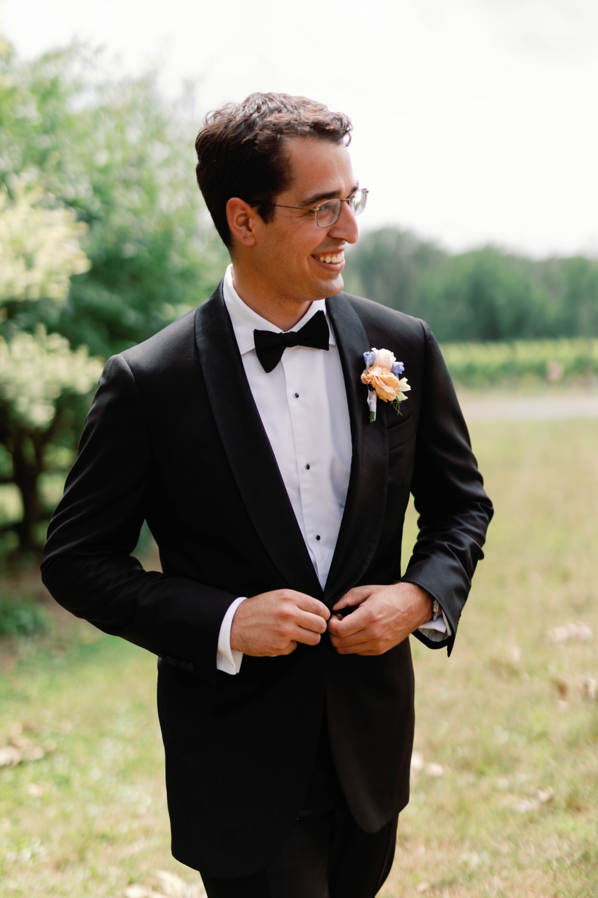 groom in tuxedo for farm wedding