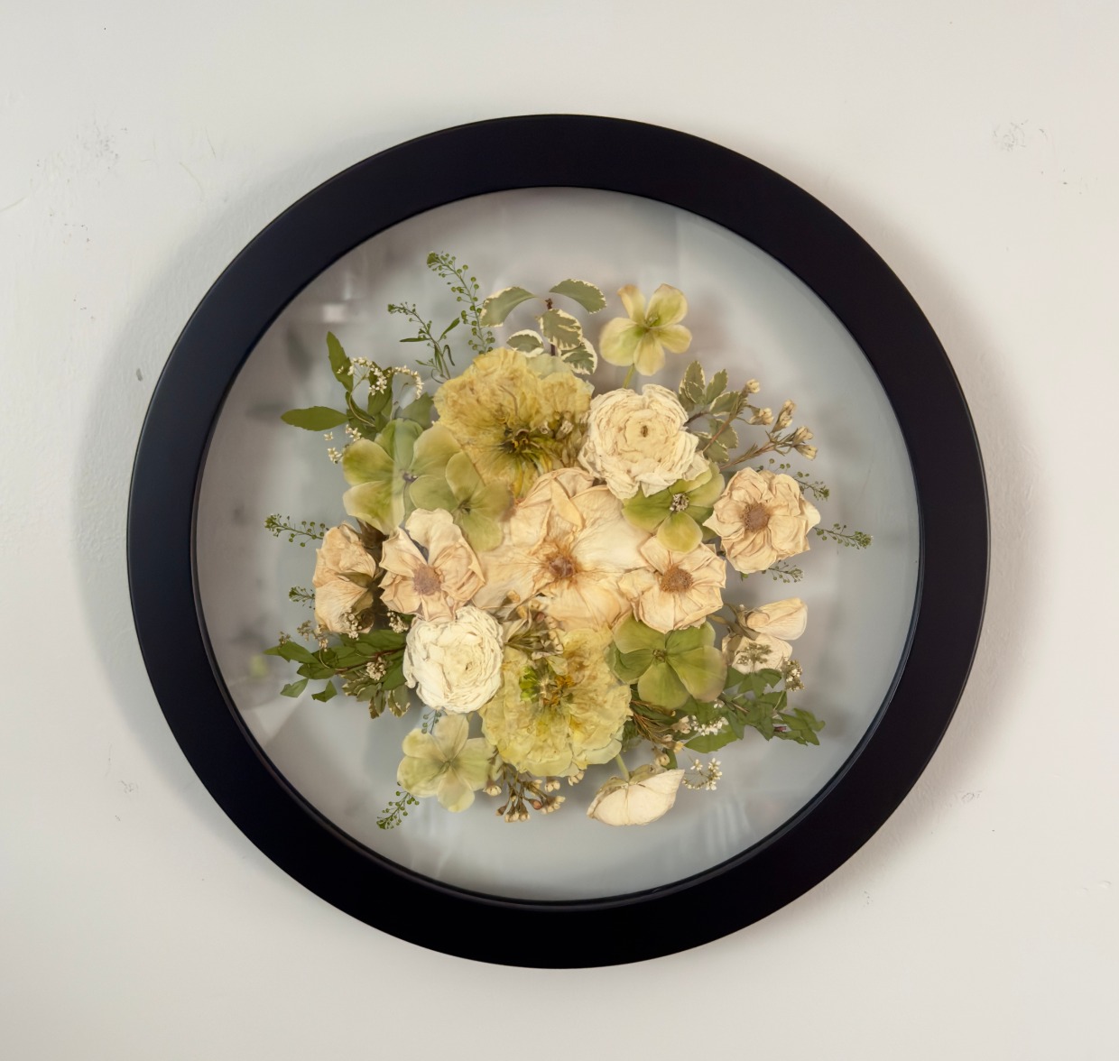 pressed bridal bouquet in a round frame by for keeps florals