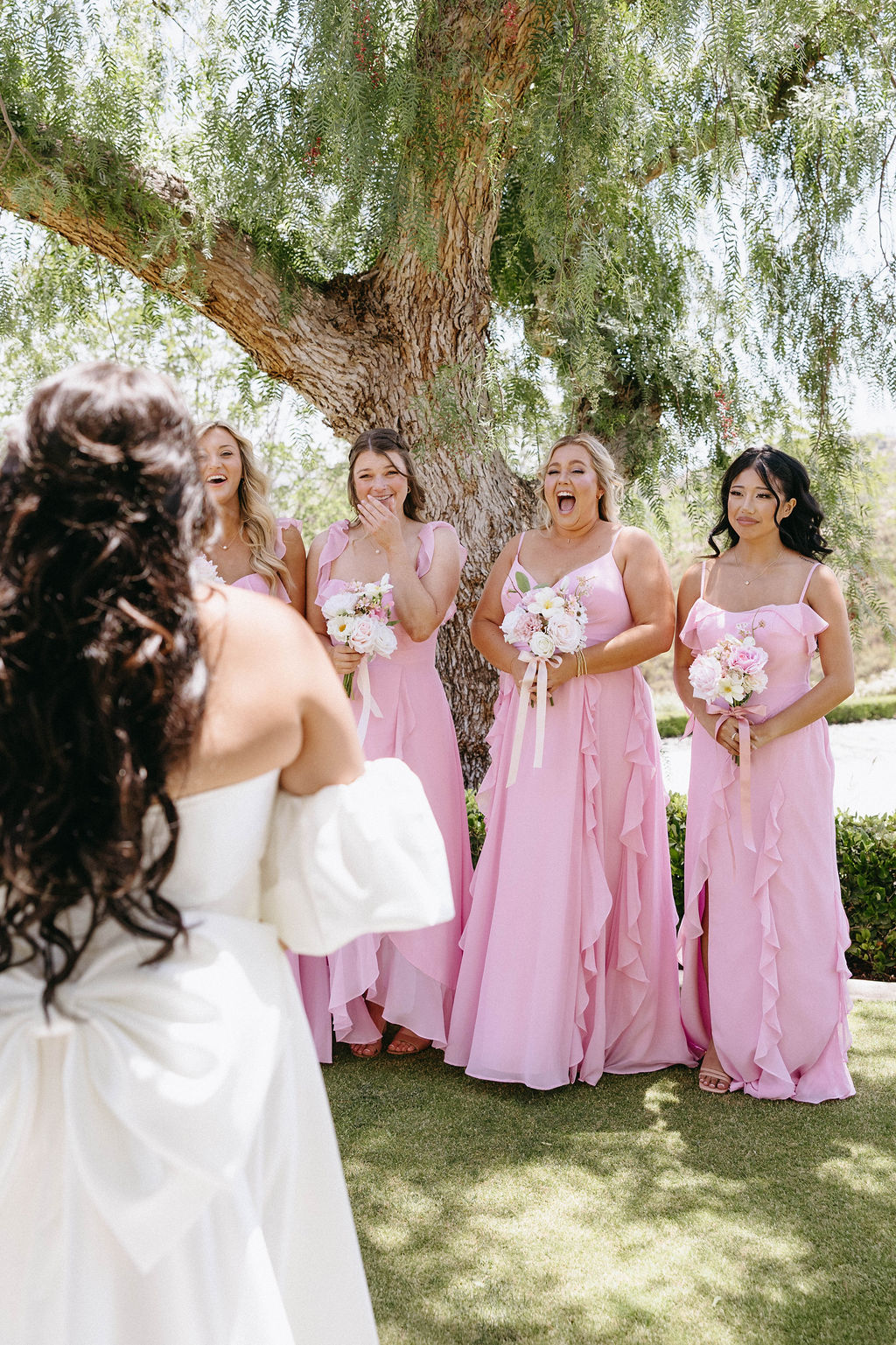 bridesmaids in pastel pink dresses