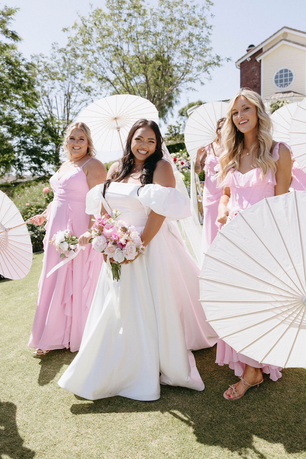 bridesmaids with parasols