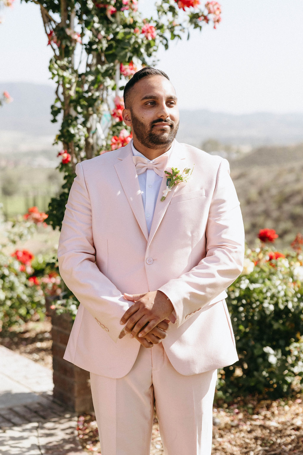 groom in pink suit