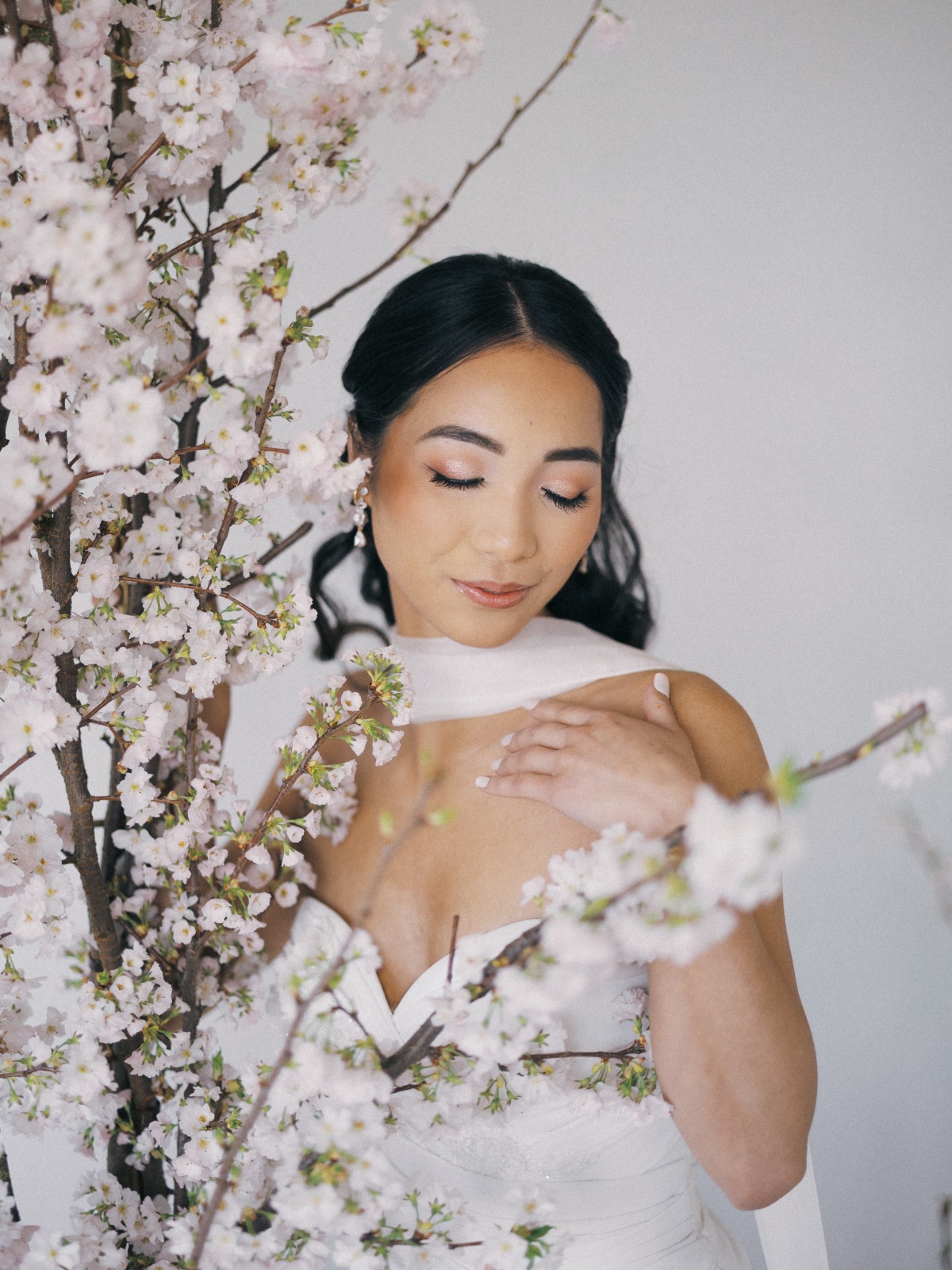 bride with cherry blossom bouquet