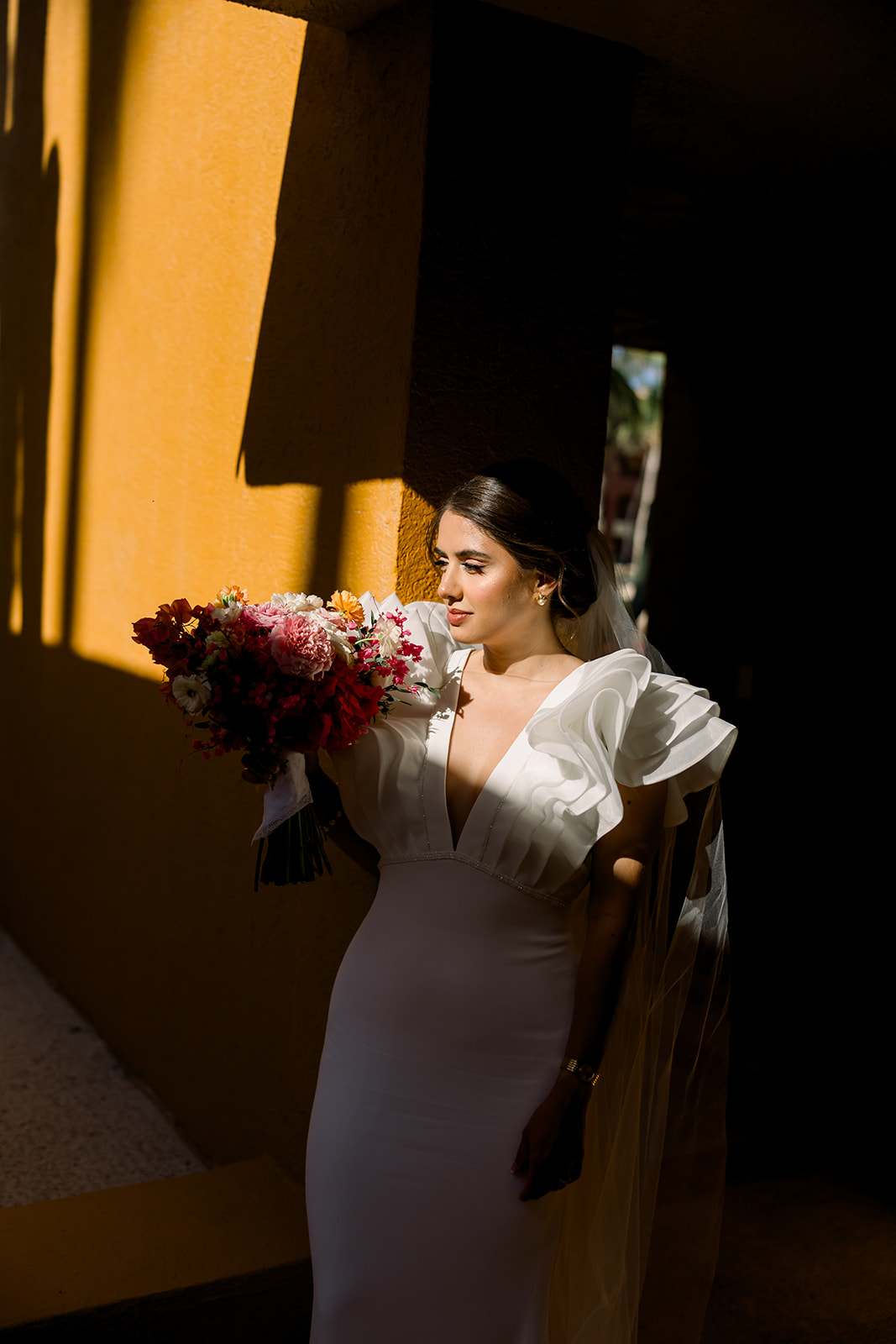 unique wedding dress with ruffled shoulders