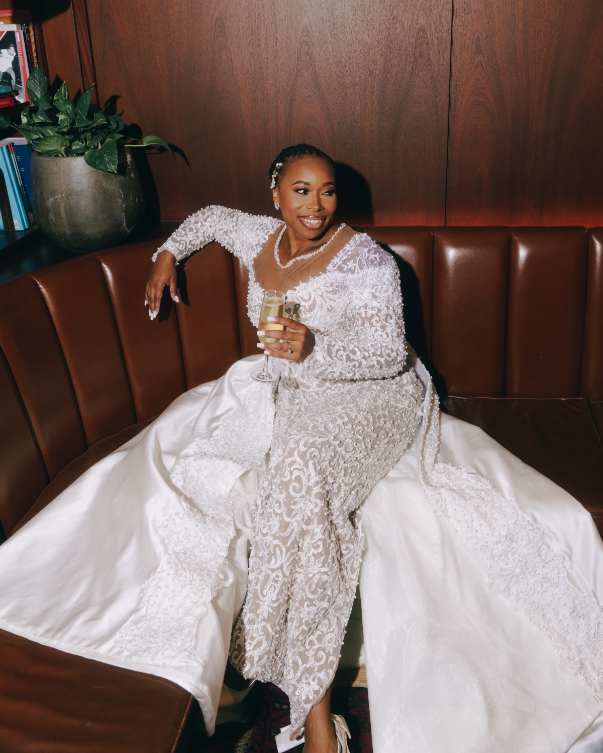 bride lounging and sipping champagne