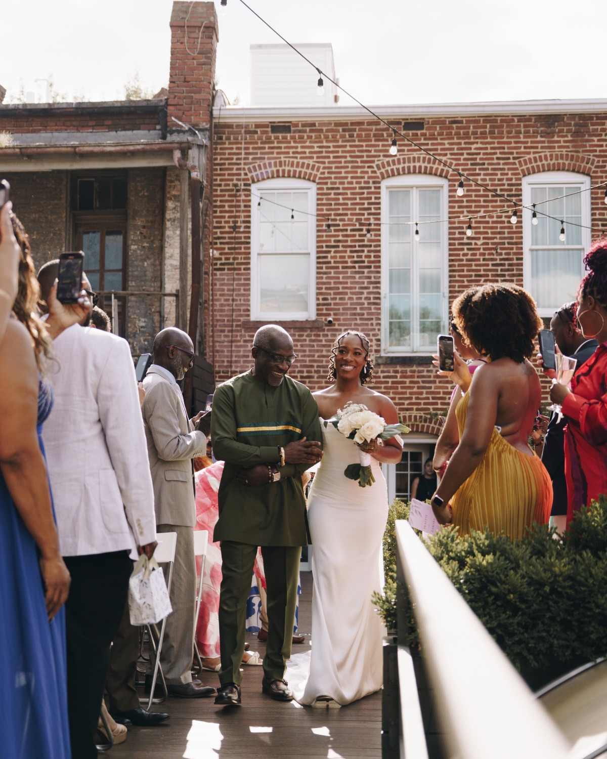 father walking bride down the aisle on rooftop garden ceremony