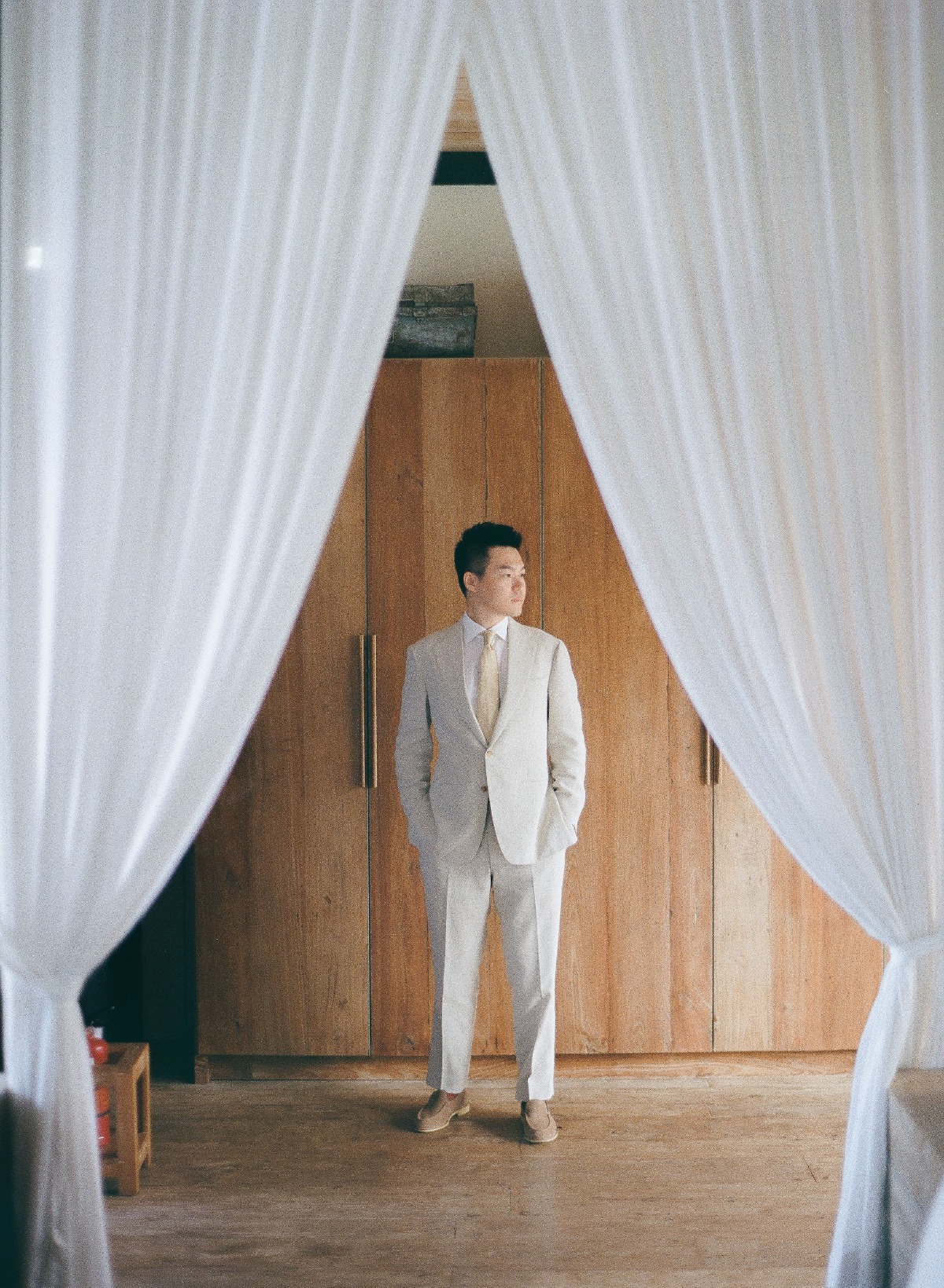 tan suit beach wedding