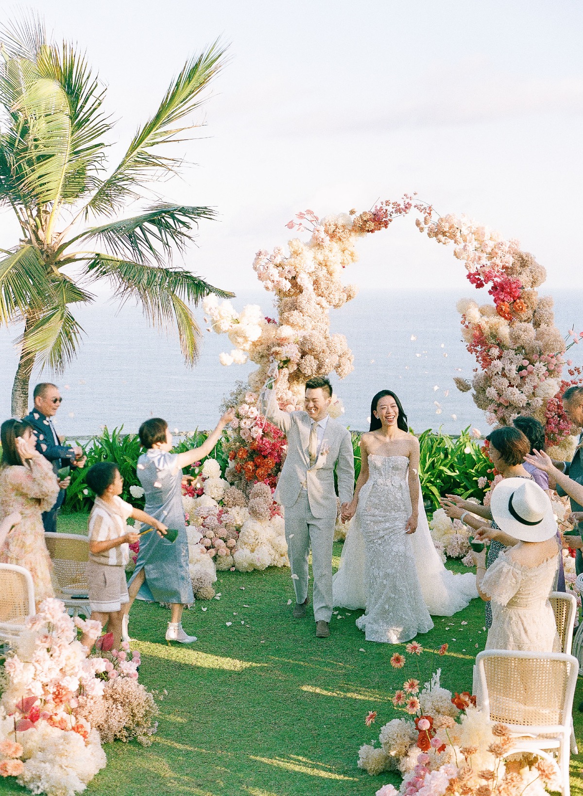 pink and peach asymmetrical floral arch