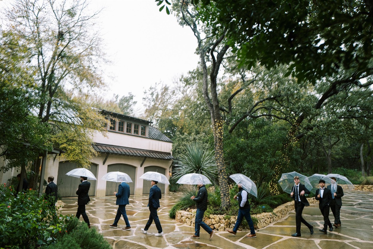groomsmen with umbrellas