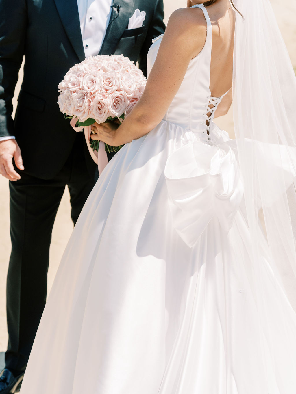 lace up wedding gown with a big bow