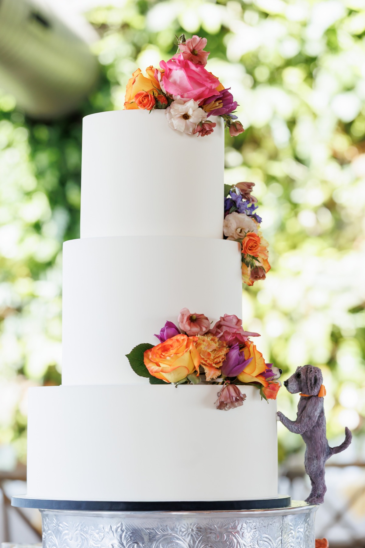 simple wedding cake with fresh flowers