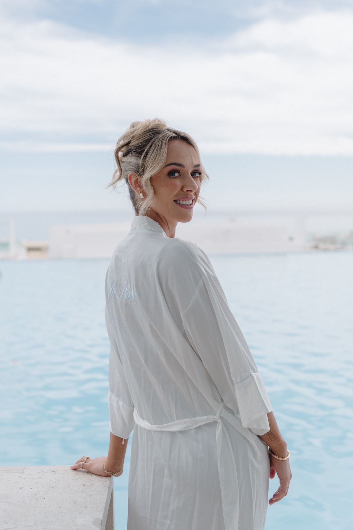 bride getting ready by pool