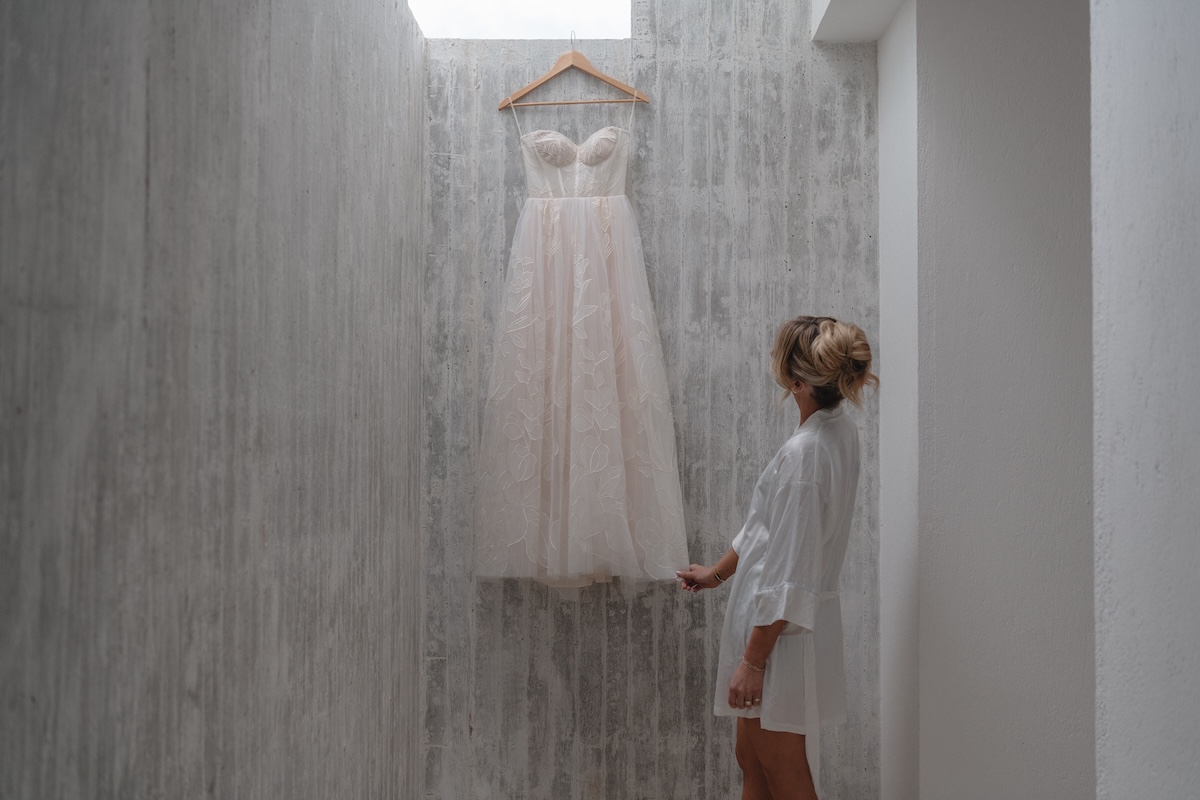 bride admiring her dress