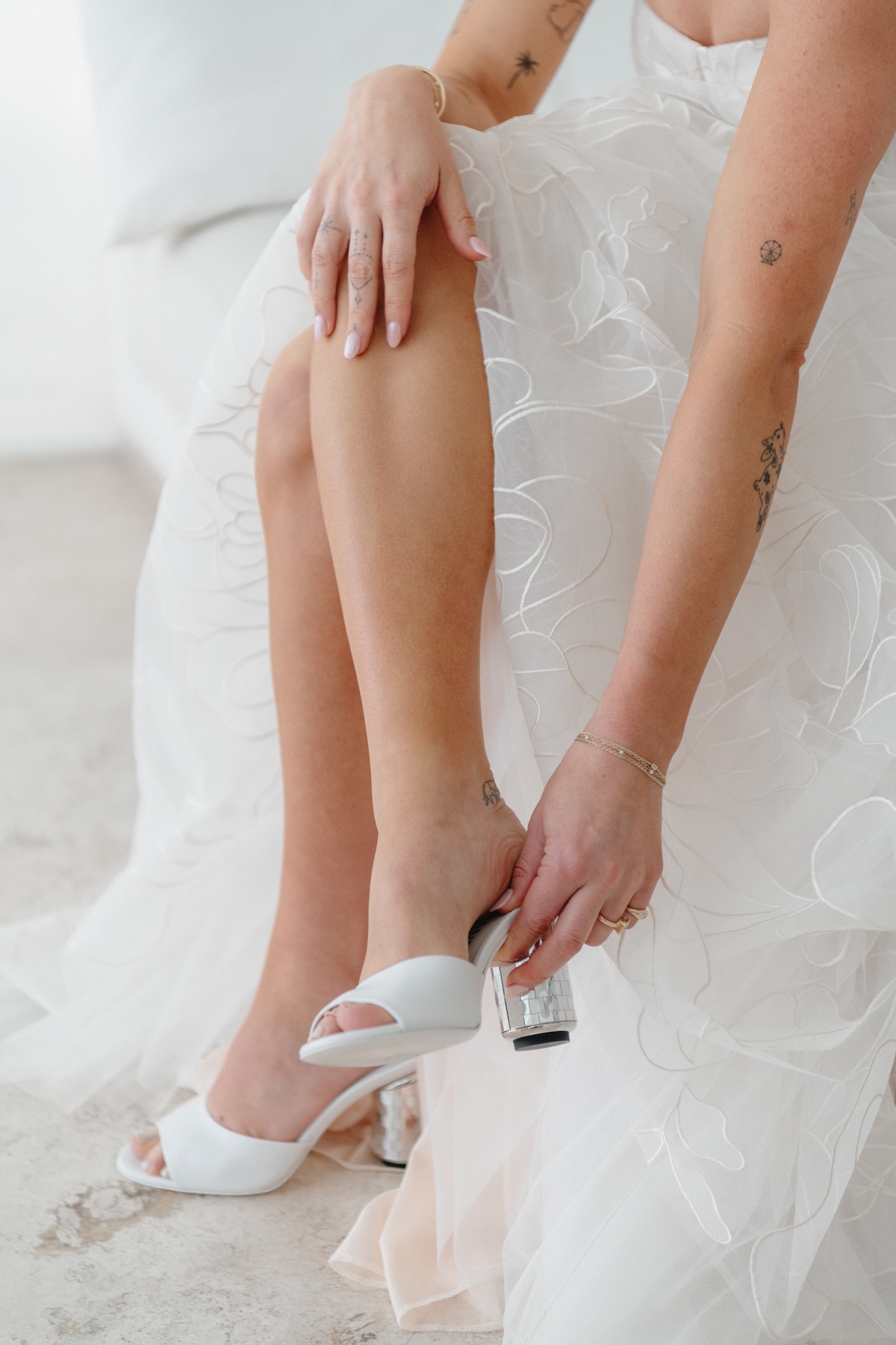 bride putting on her shoes