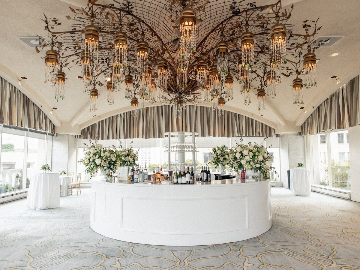 white and off-white large wedding bar floral arrangements