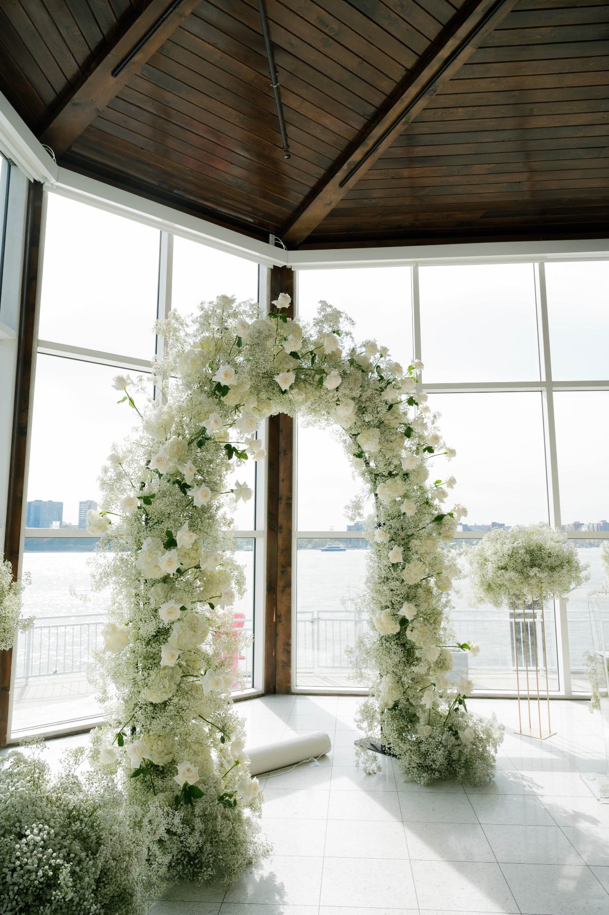 oversized white rose and baby's breath arch