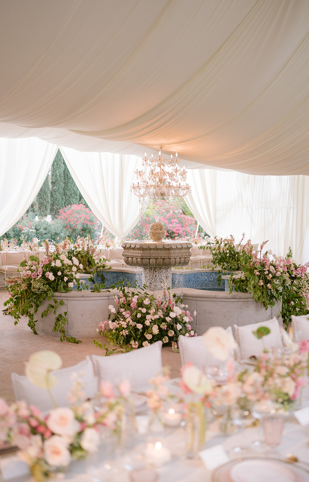 fountain at the center of a wedding reception tent