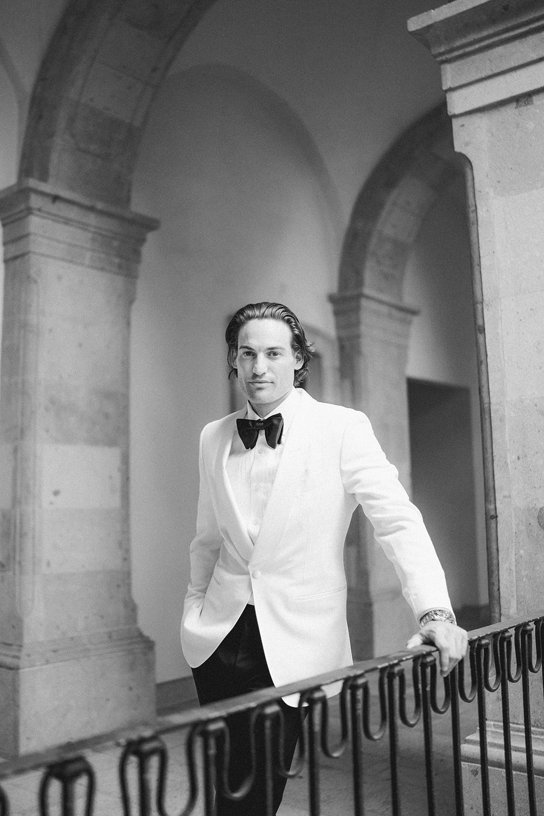 groom in white dinner jacket