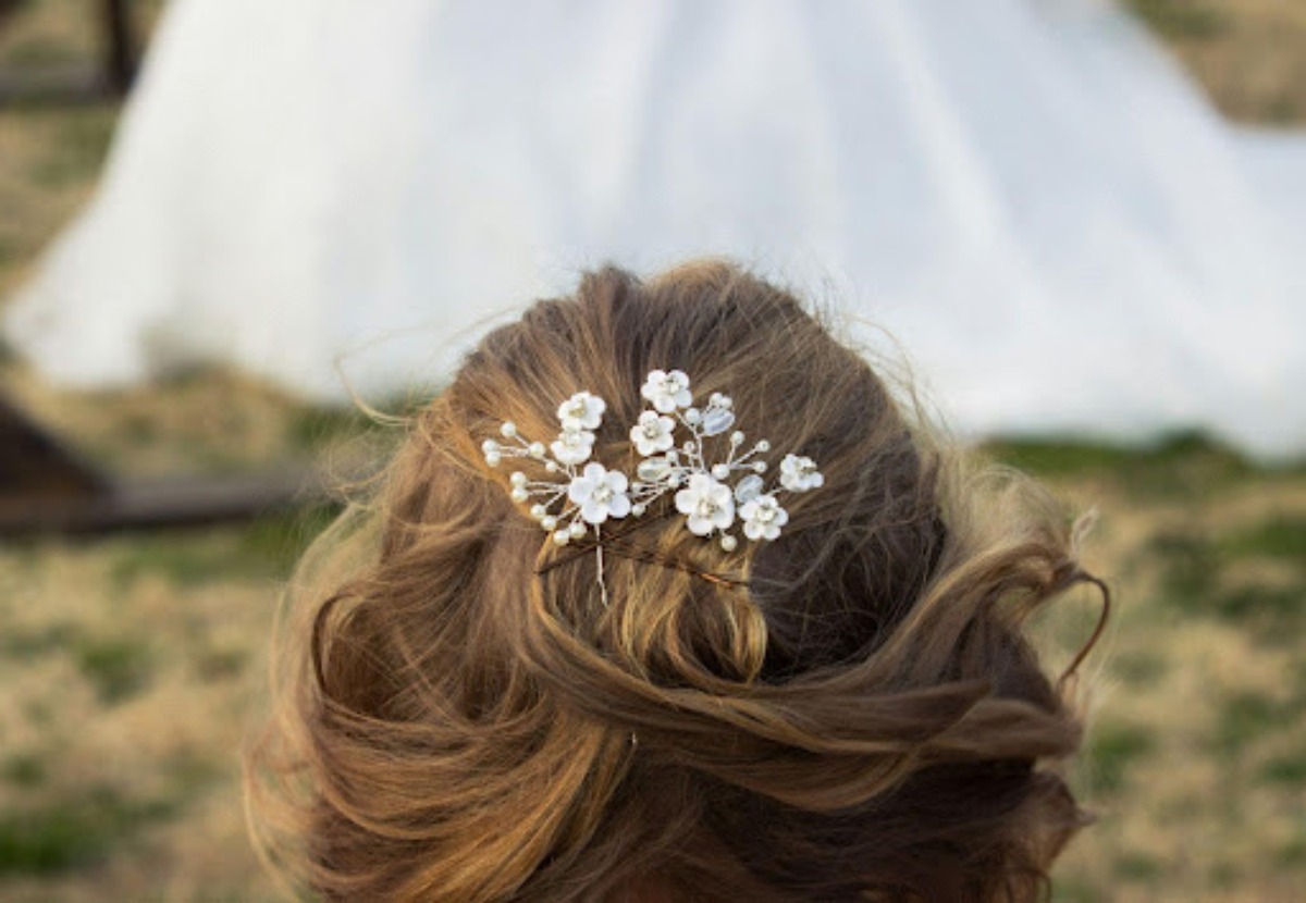 back of brides hair with floral clip