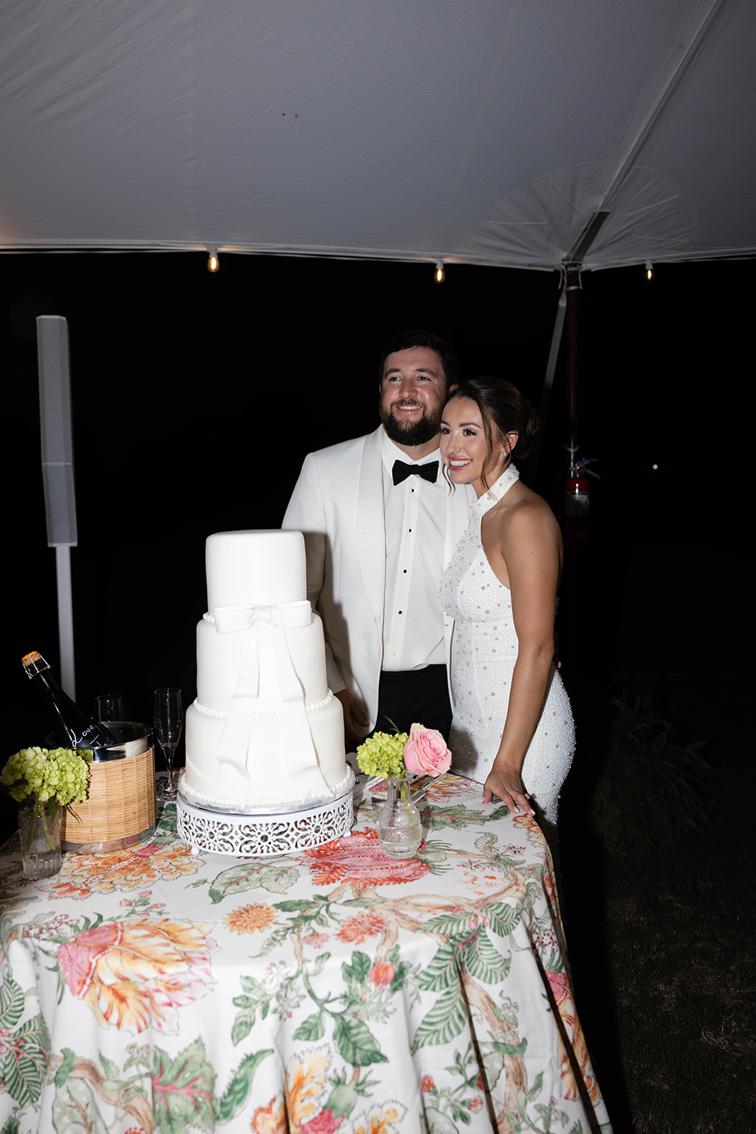 classic white fondant wedding cake with bow