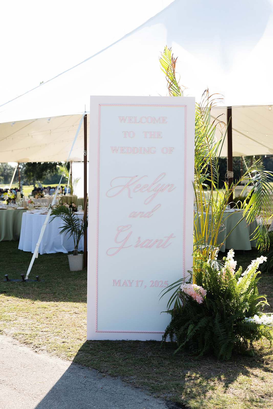 pink and white wedding sign
