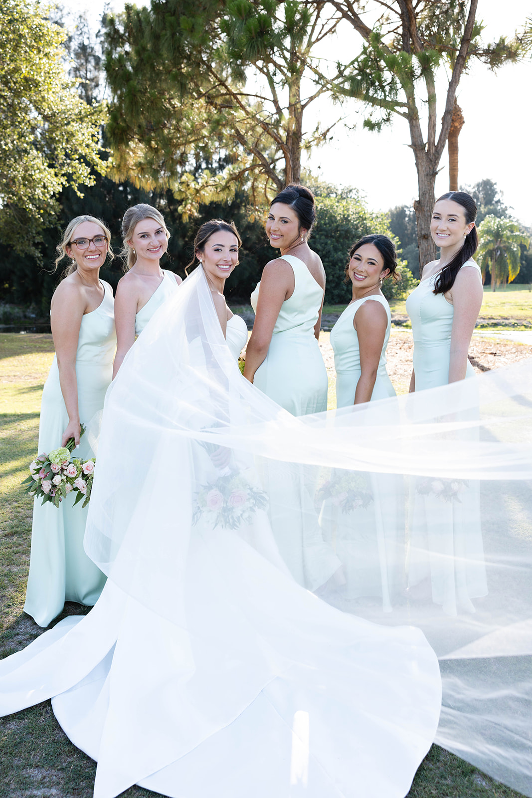 bridesmaids in light green dresses