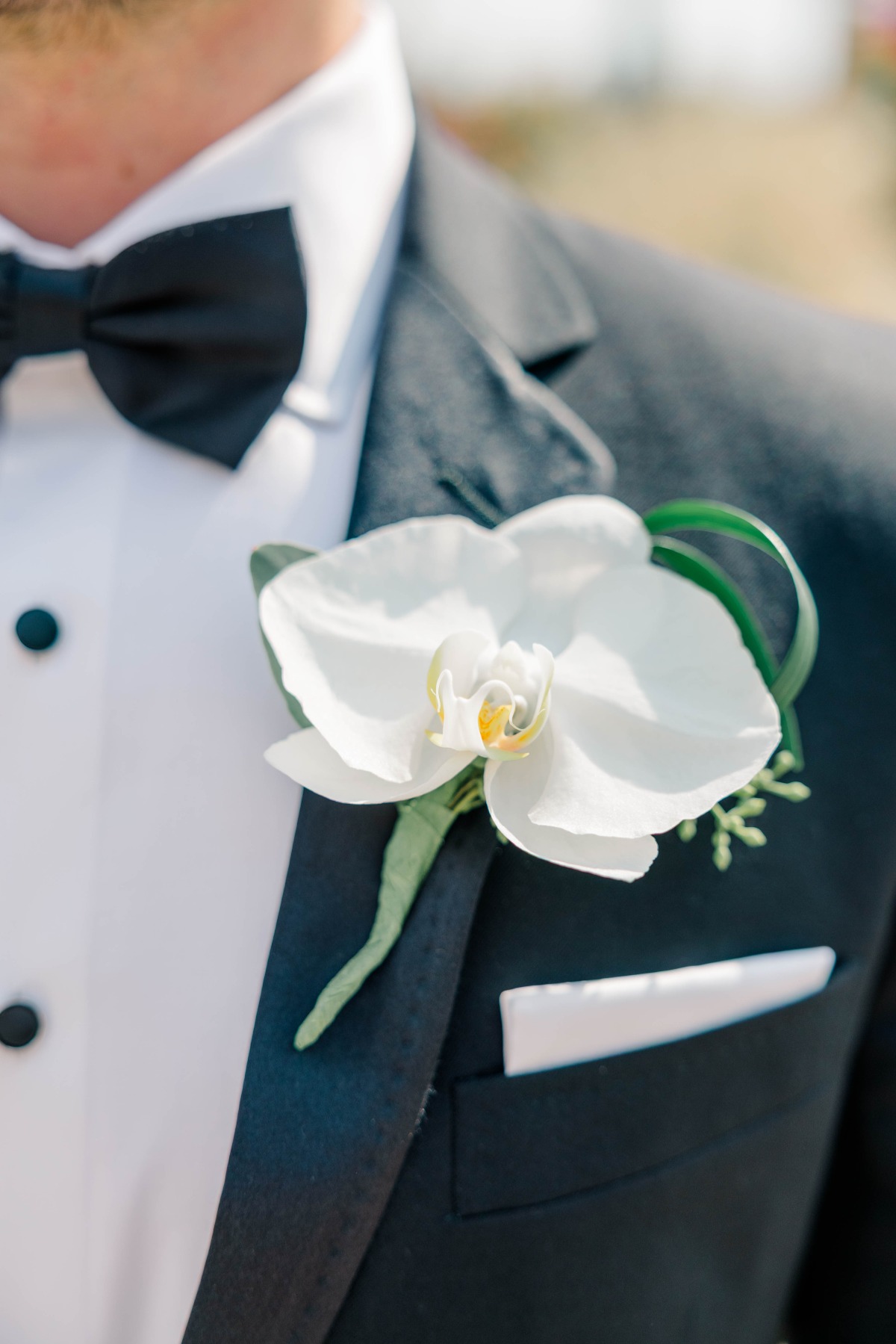 white orchid boutonniere