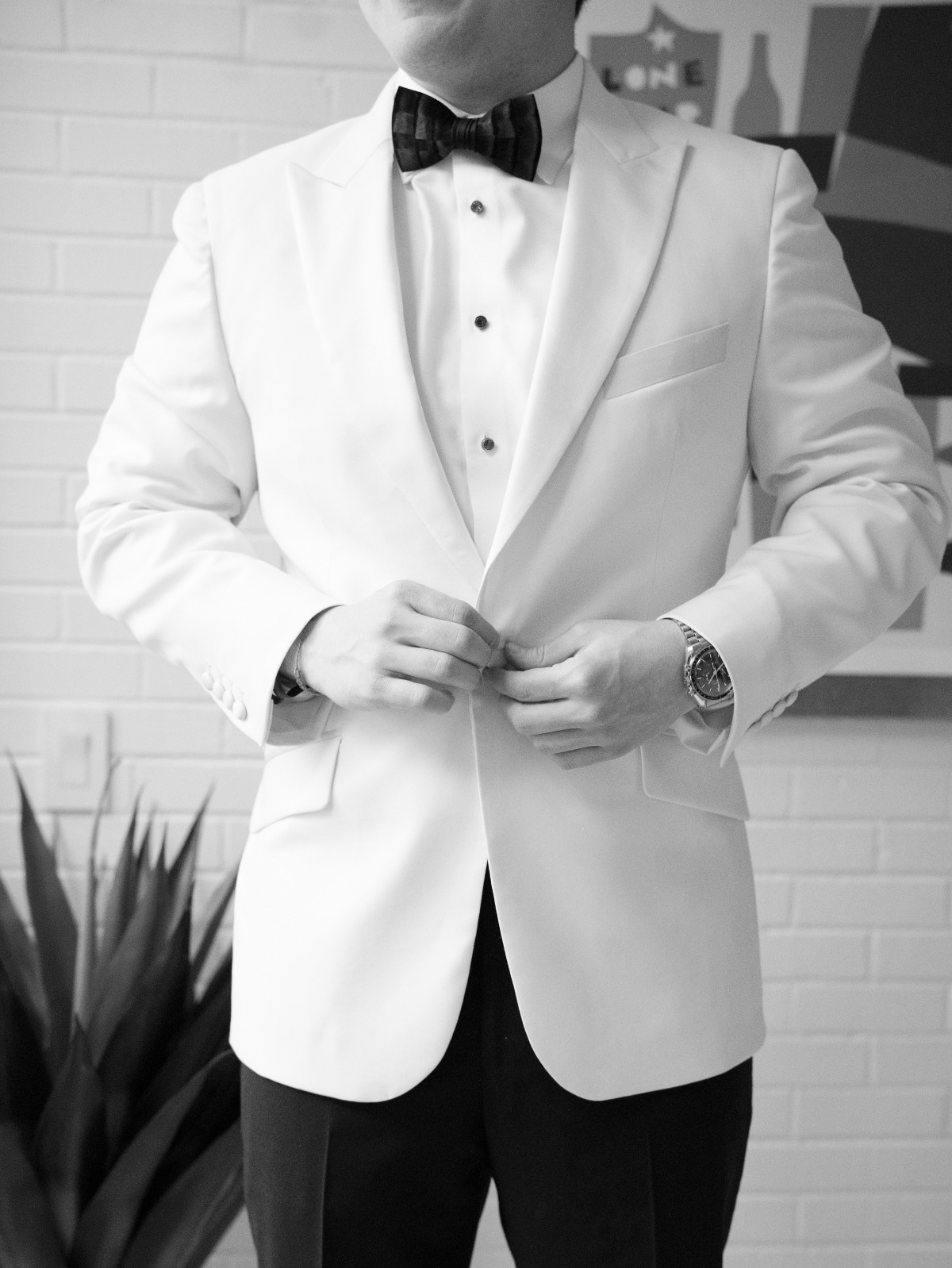 groom in white jacket