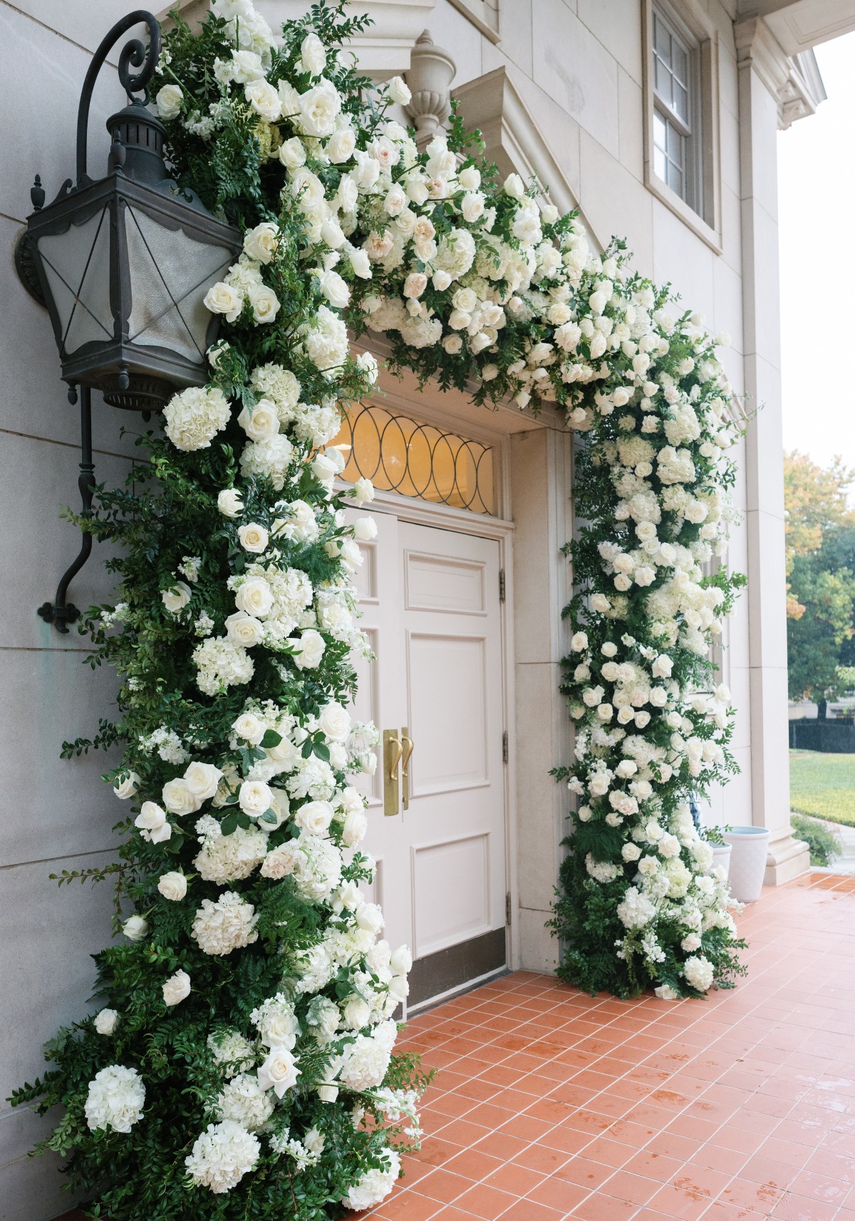 white floral arch for wedding venue