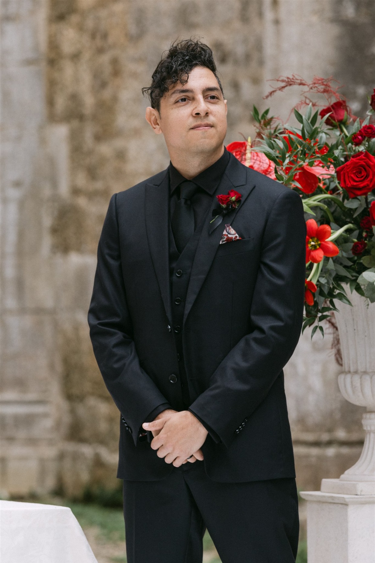 groom in black on black suit galia lahav