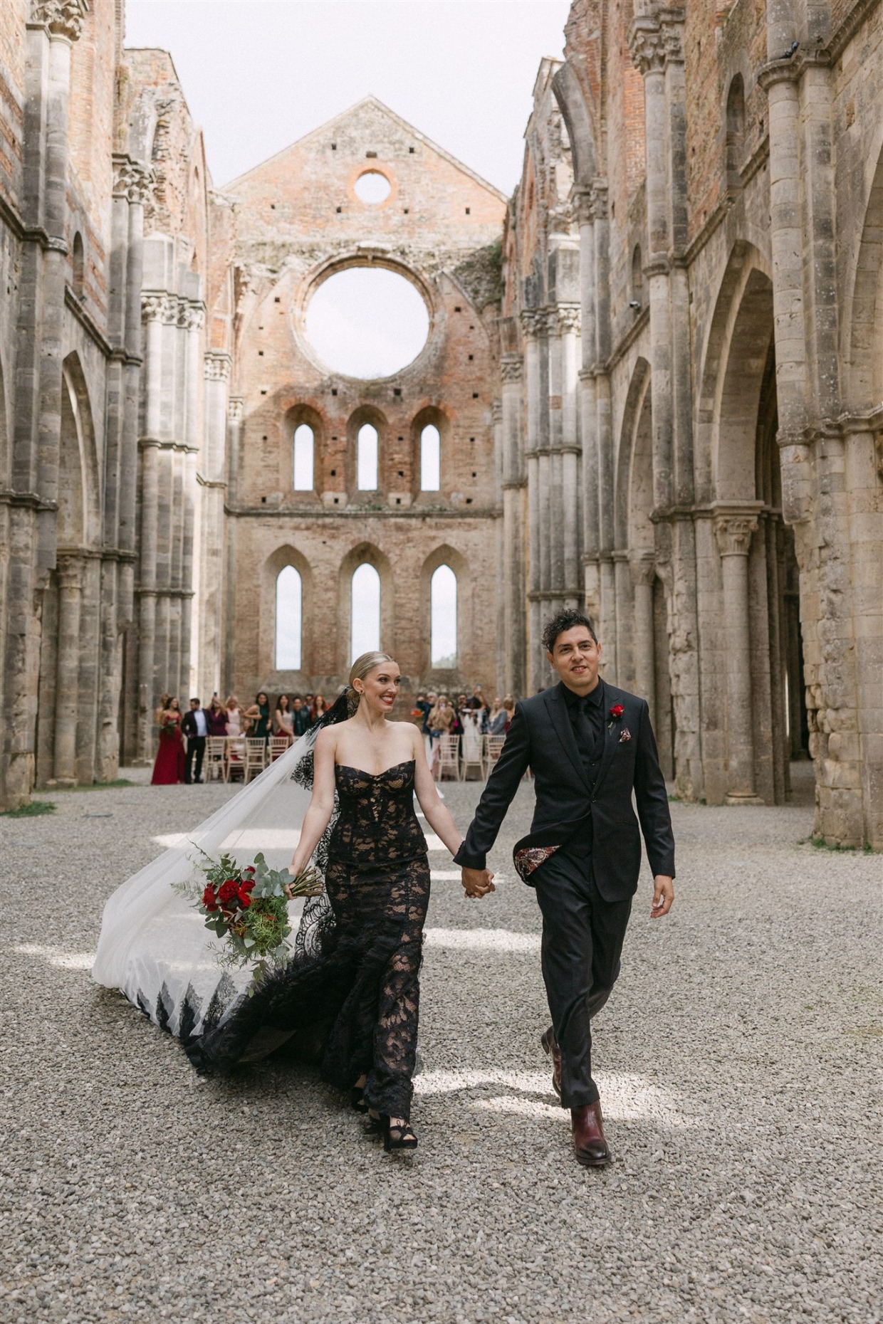 bride in a black gown fuego by galia lahav
