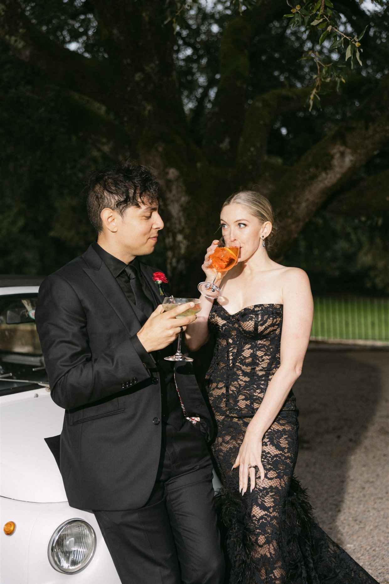 bride in fuego gown by galia lahav sipping cocktail