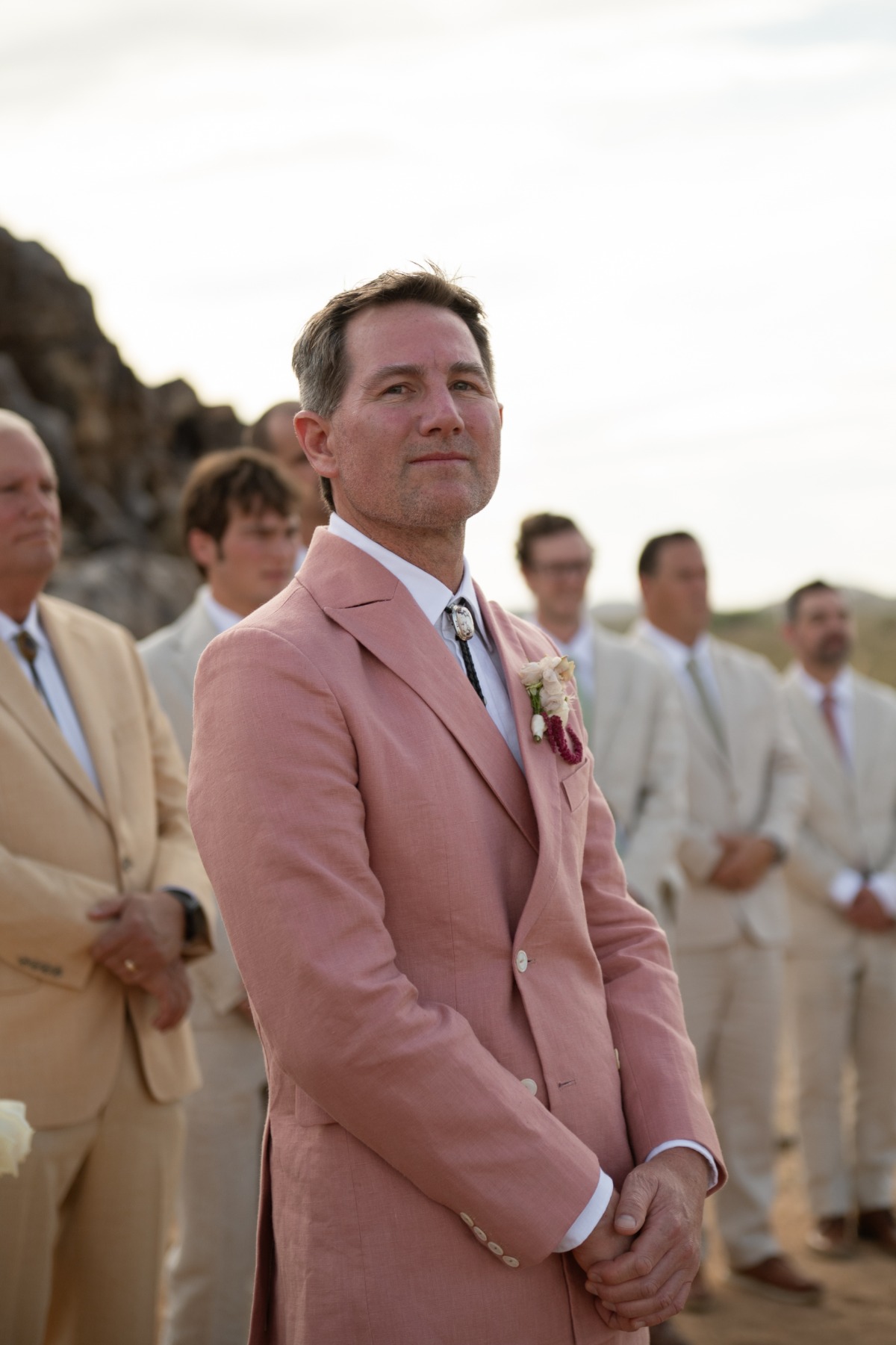 groom in pink suit