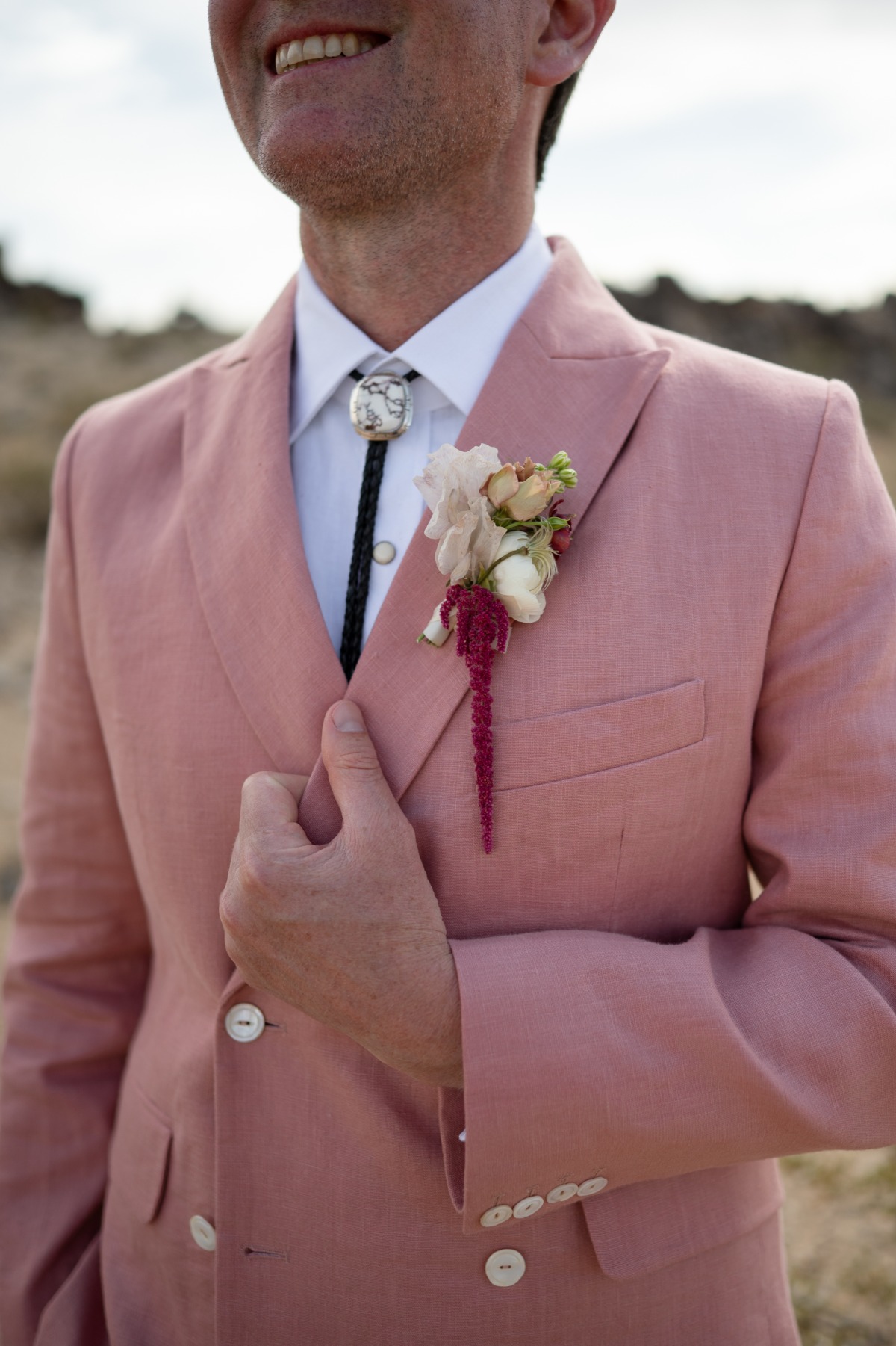 groom in pink double breasted suit