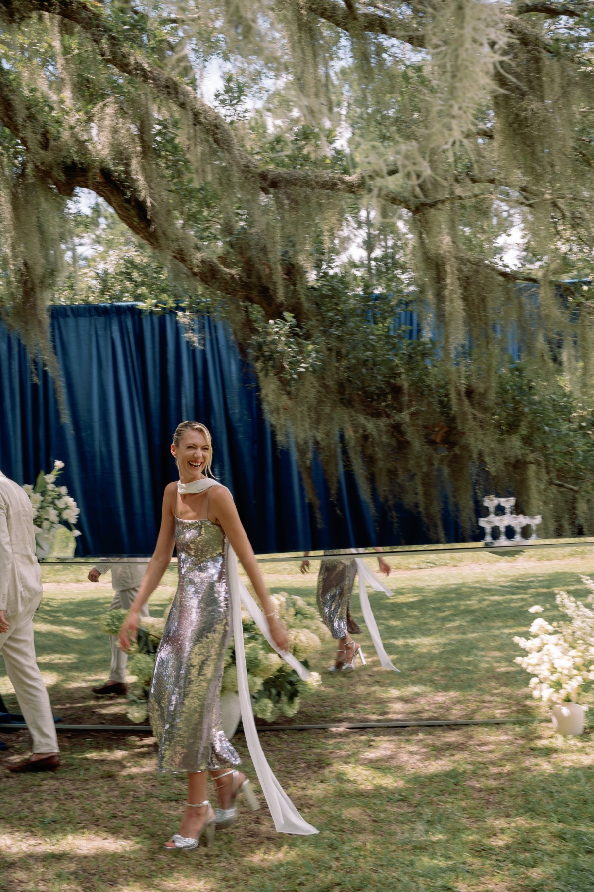 bride in silver sequin dress