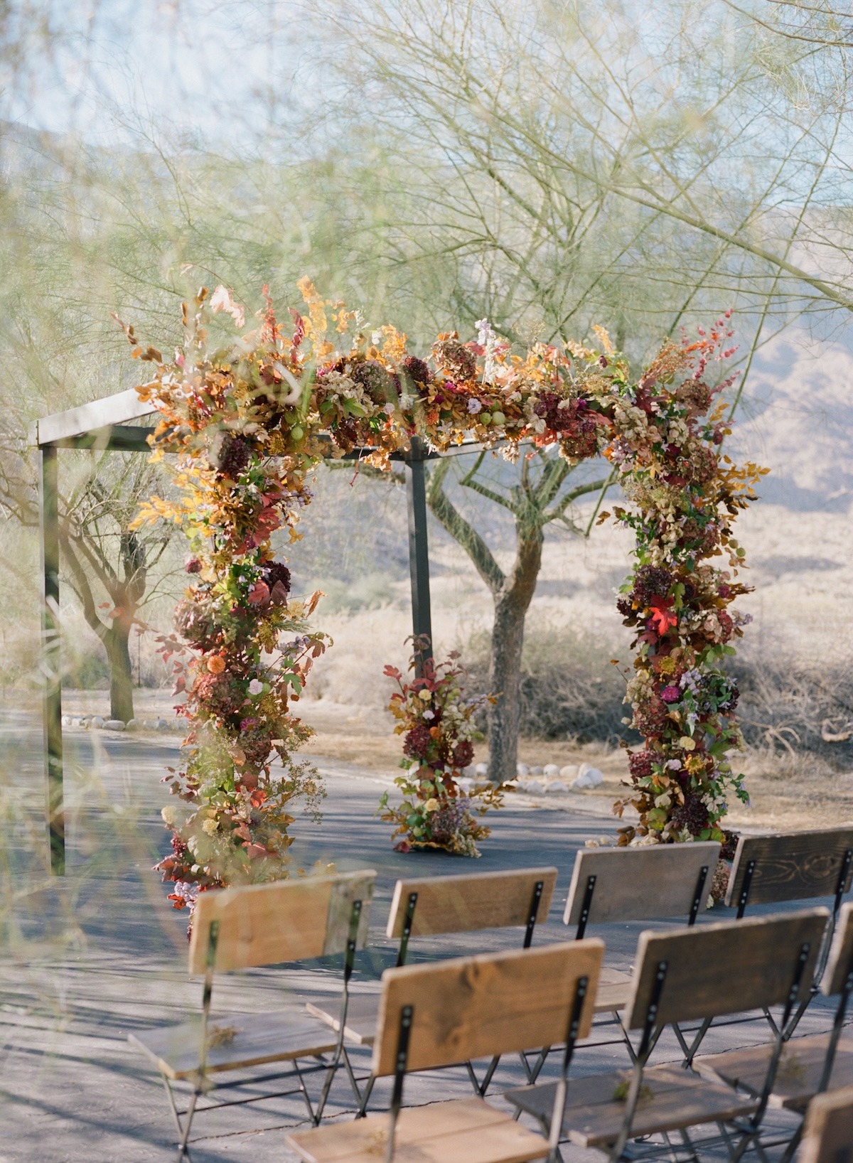 maroon and gold floral arch