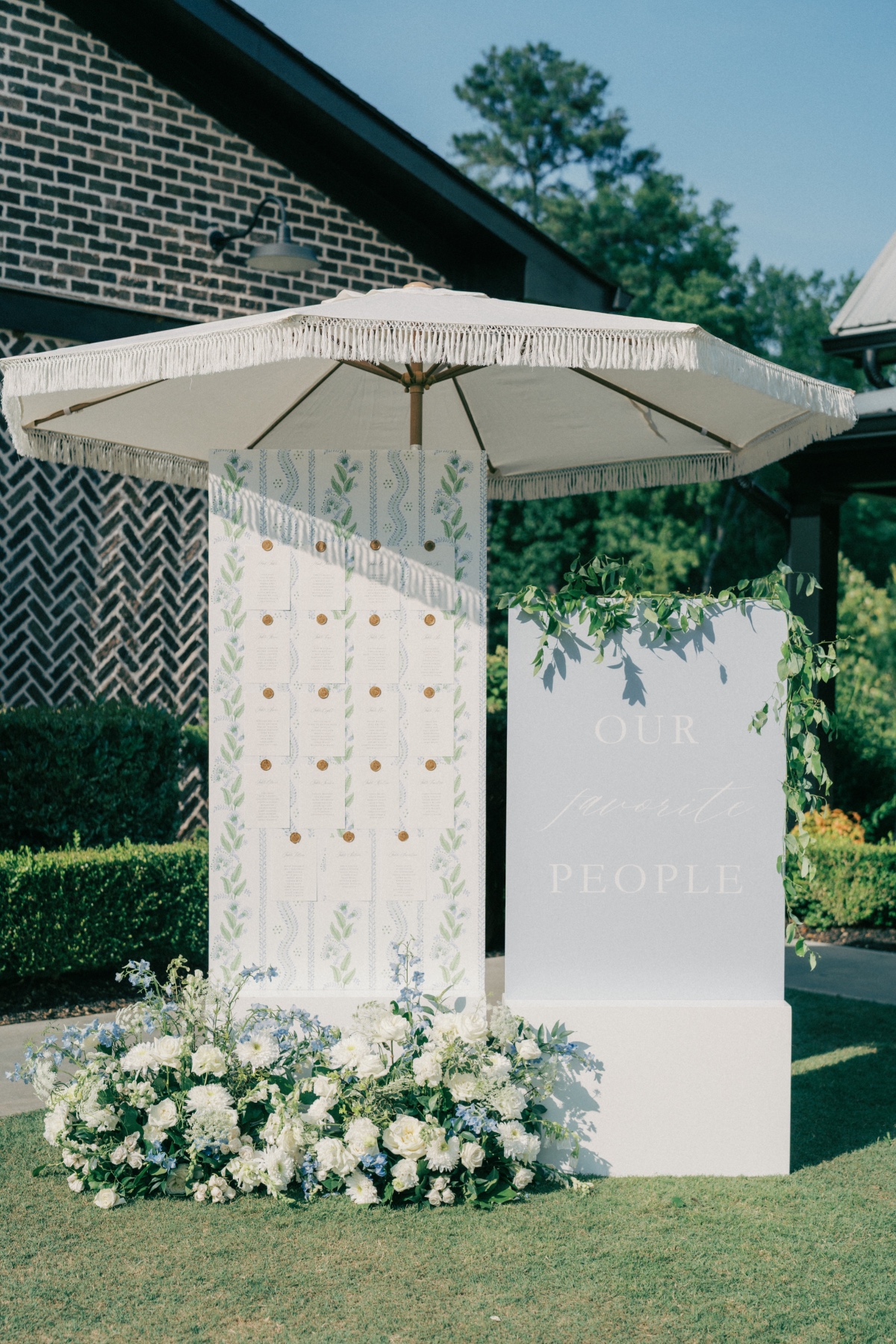 blue white and sage wedding escort display