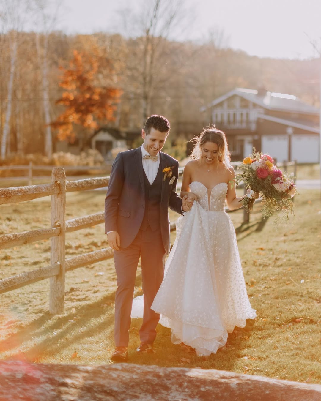 couple walking in the golden hour during the vermont fal