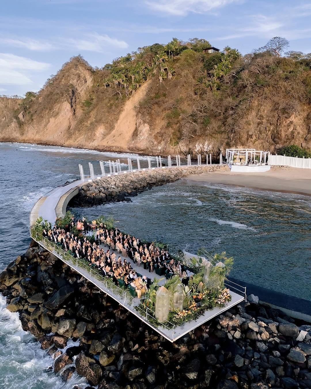 unique wedding venue cascading into rocks over the ocean