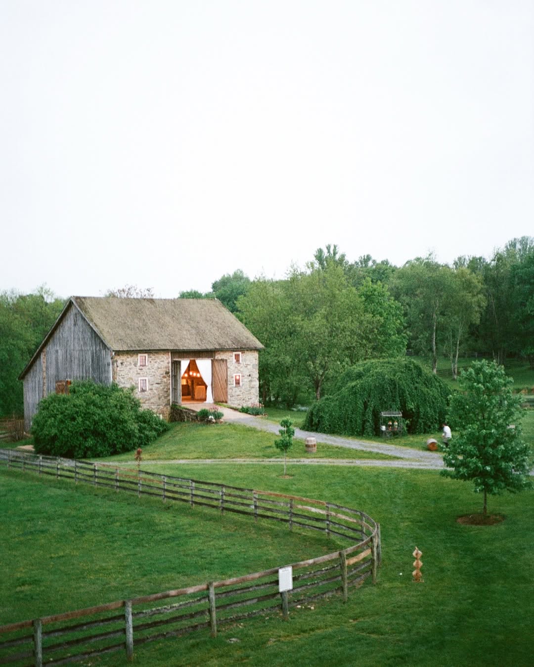 beautiful greenery landscape with cobblestone barn
