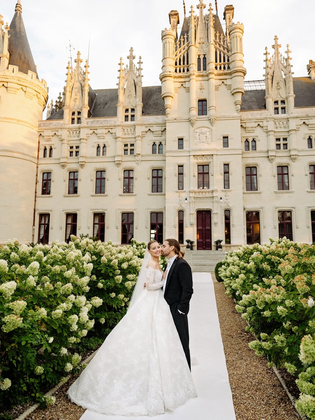 couple in front of french wedding chateau castle