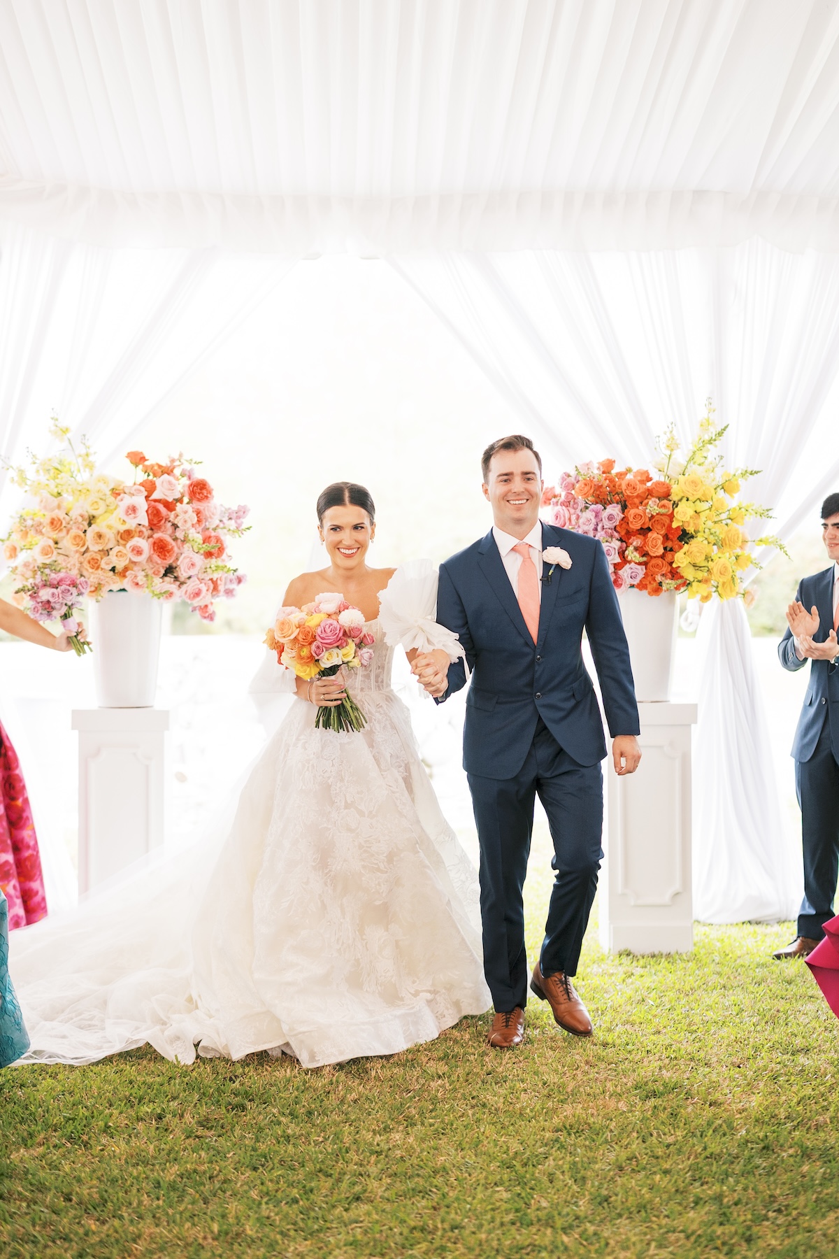 citrus colored ceremony flowers