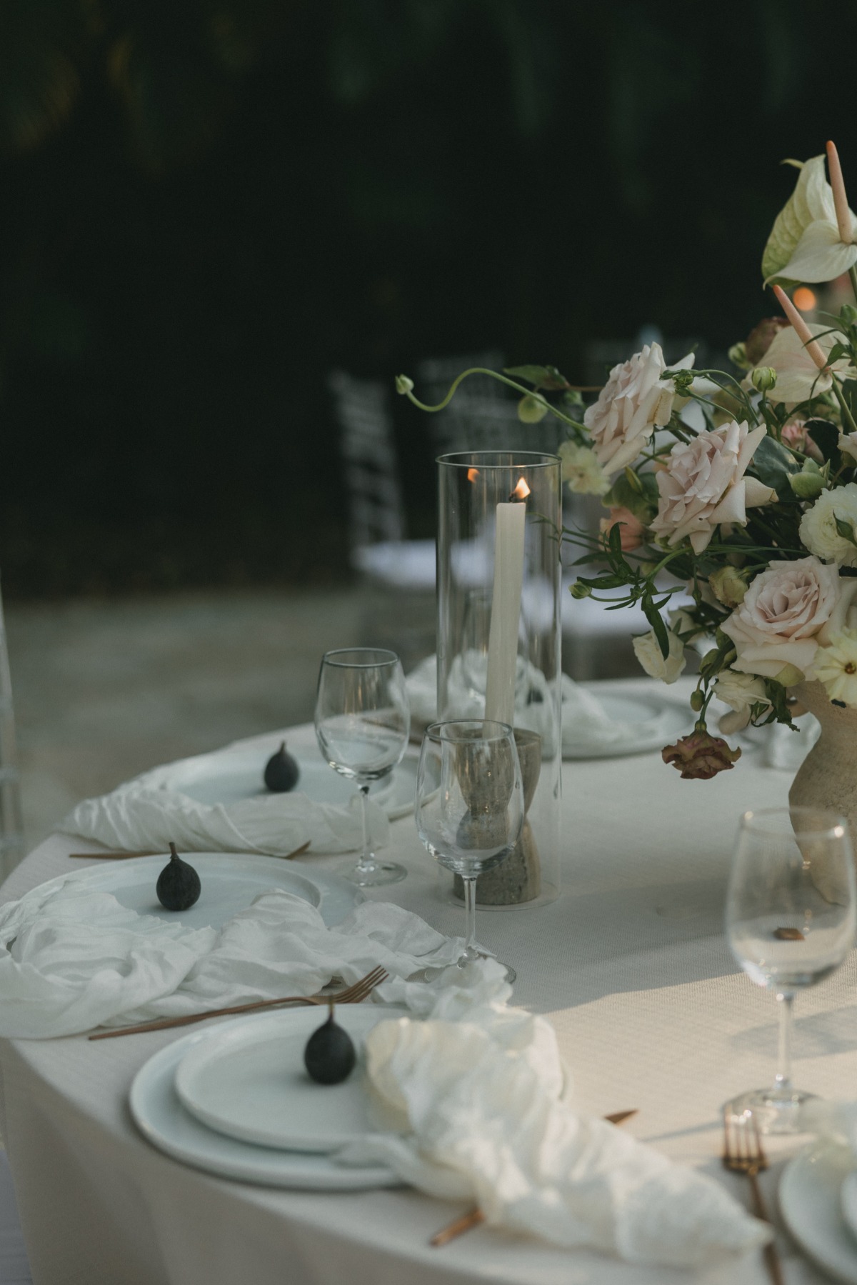 side view of circle reception table with white table cloths