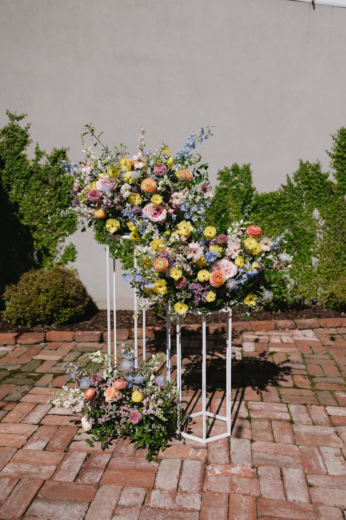 pastel wedding flowers on pillars