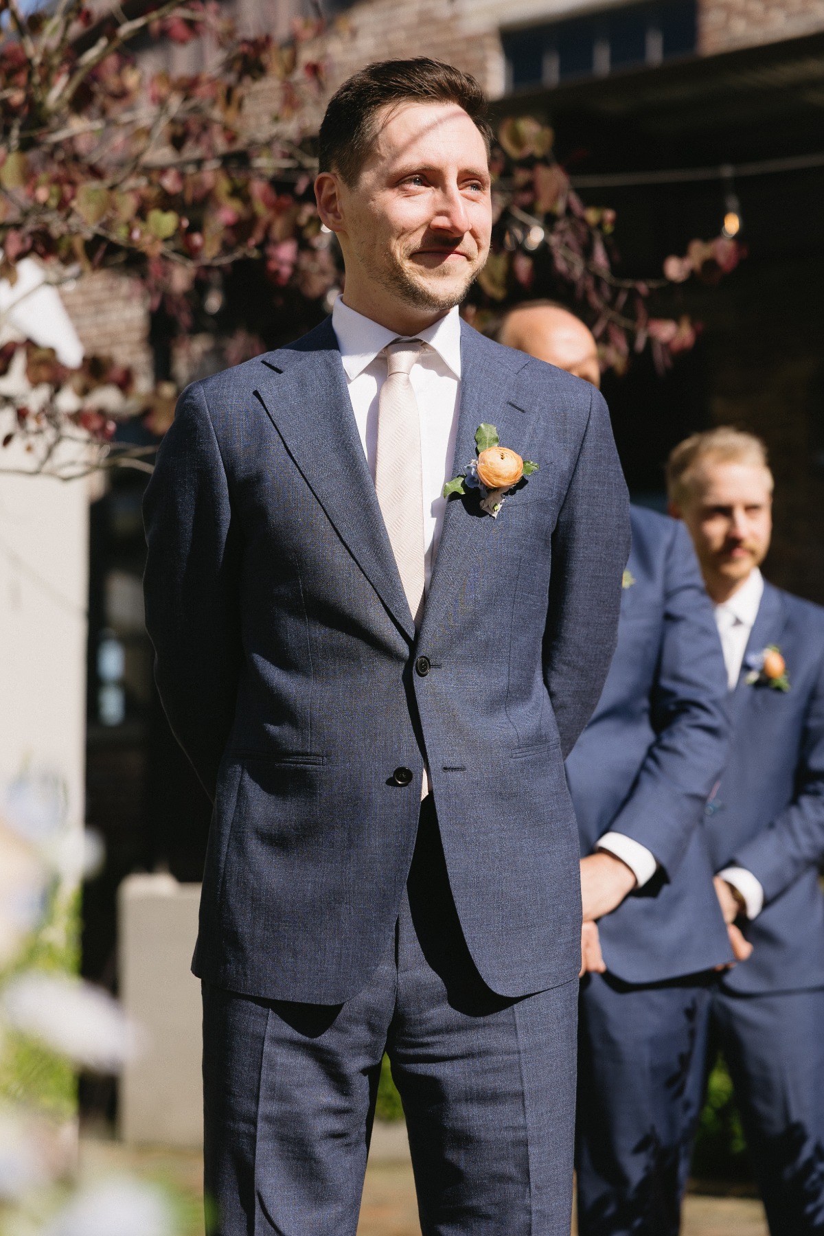 groom in navy suit