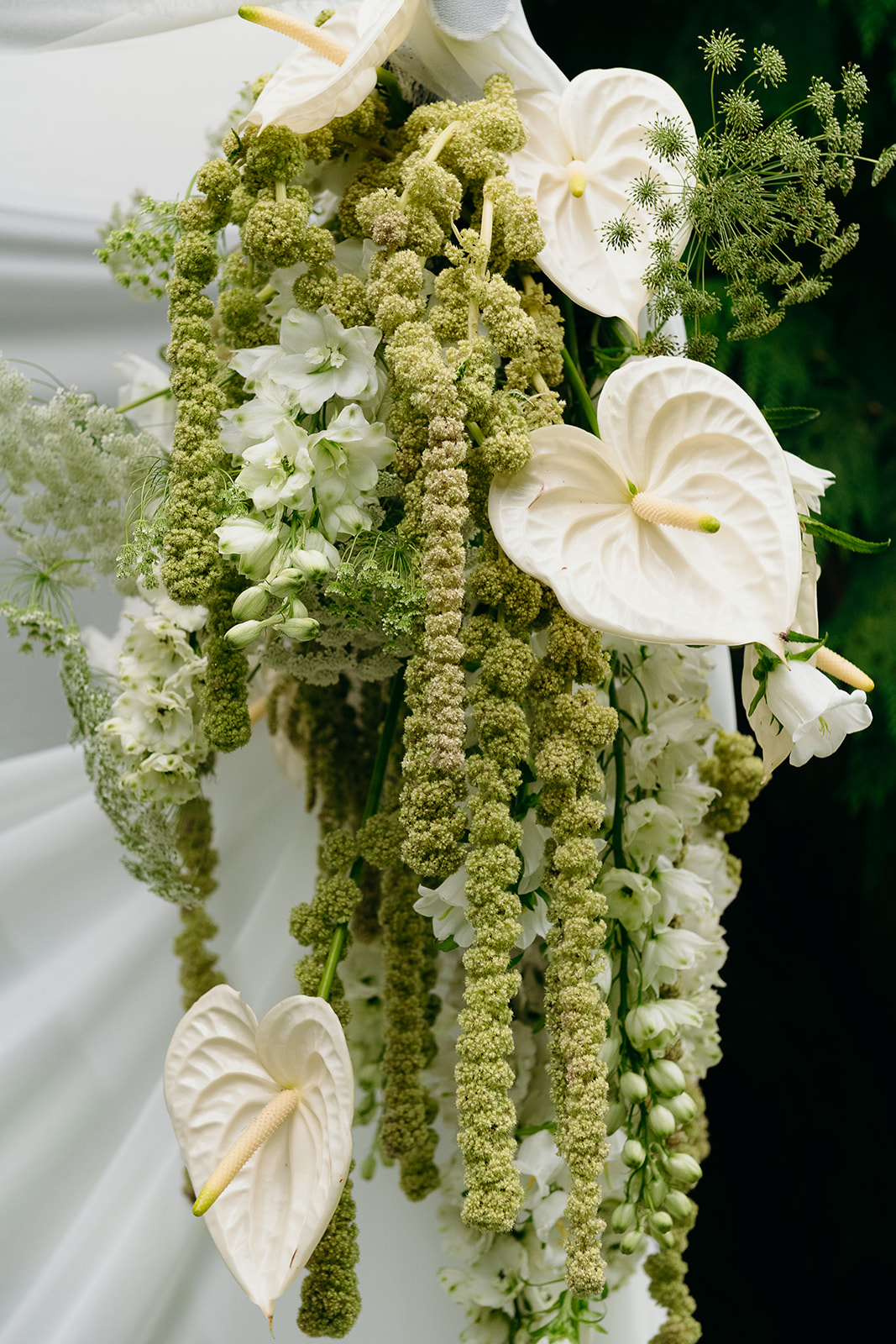 dripping floral installation on draping