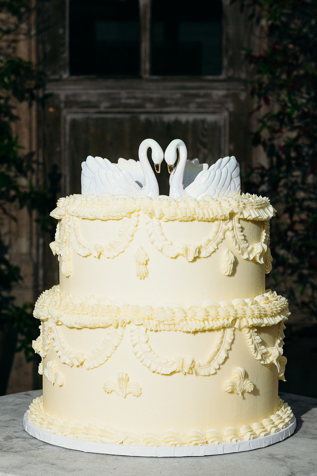 vintage wedding cake with swan topper