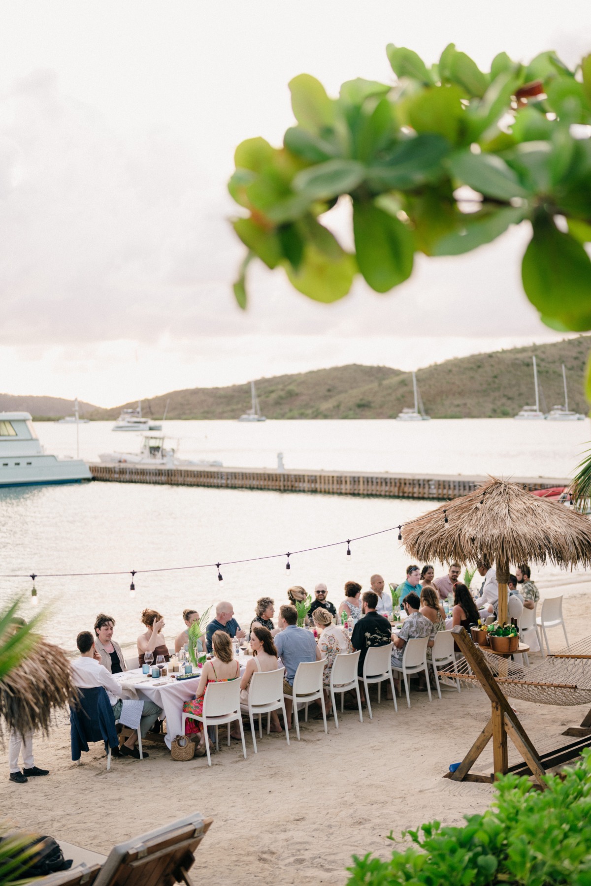 small wedding party having dinner on beach