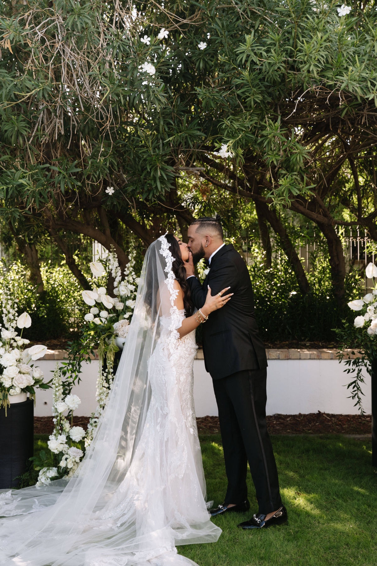 bride and groom kiss